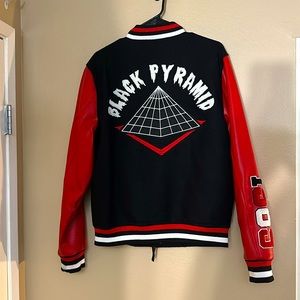 CHRIS BROWN COLLECTION: BLACK PYRAMID VARAITY JACKET.   USED. MEDIUM.